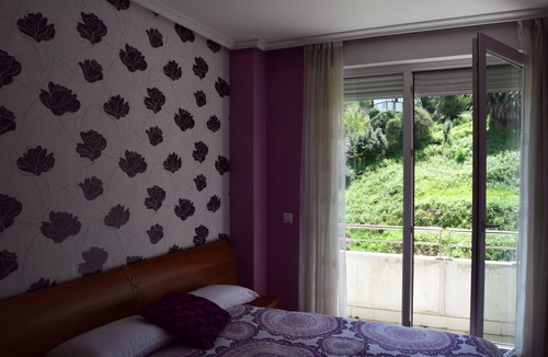 Castro Urdiales Apartment | Apartment with 2 Terraces, Sea Views, Pool, and Garden