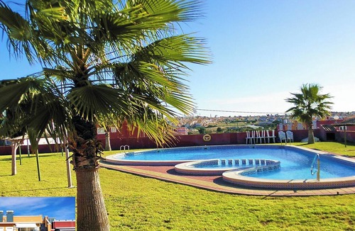 Orihuela Costa Apartment | Apartment with Large Roof Solarium, Pool, Garden, Barbecue, A/C & Wi-Fi