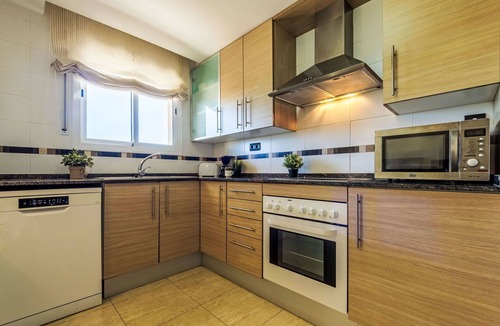 Sant Carles de la Rapita Apartment | Cosy apartment for 4 guests with A/C, WIFI, pool, TV and balcony
