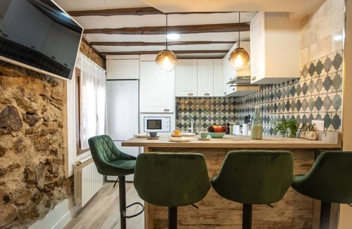 Miraflores de la Sierra Apartment | Recharge your batteries!Charming and cozy town house 7 minutes walk from the center and five from the river. Completely renovated in a retro style, preserving the natural stone and decoration brought from all over the world.Perfect to rest with great det