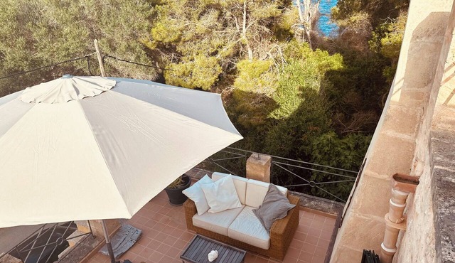 A dreamy Mediterranean retreat in the Mallorcan style, right on the beach & MB in Cala Llombards