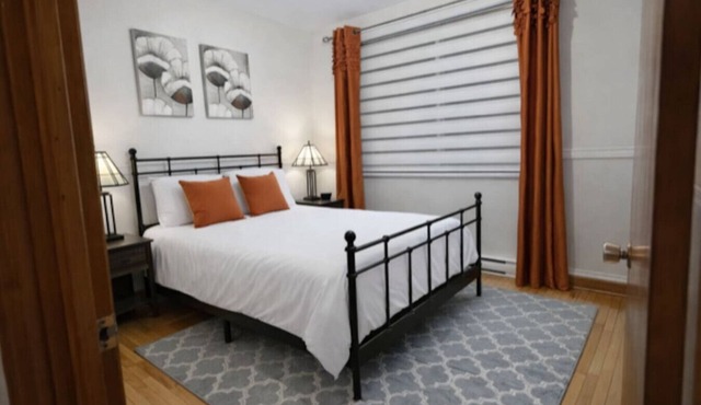 Cozy 3BR Getaway with Backyard & Included parking in Montreal