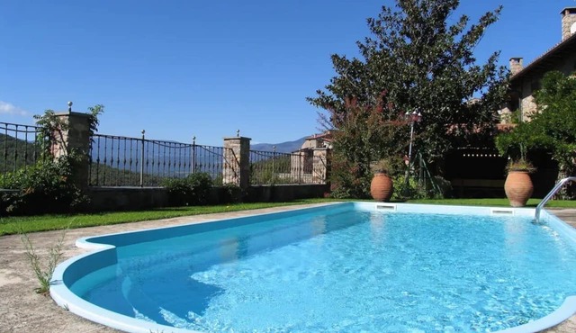 House with swimming pool in the middle of nature