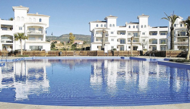 This modern apartment on the 2nd floor is located in the Hacienda Riquelme golf resort.