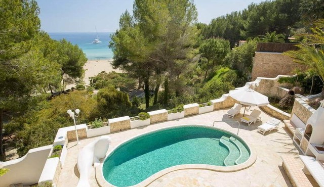 Top Holiday villa with pool, 1st line on the beach - unique in Ibiza