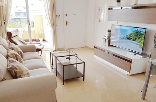 Orihuela Costa Apartment | Apartment with Large Roof Solarium, Pool, Garden, Barbecue, A/C & Wi-Fi